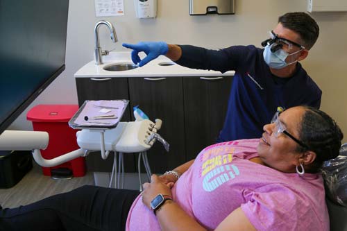 A dentist with a patient at the Culinary Health Center
